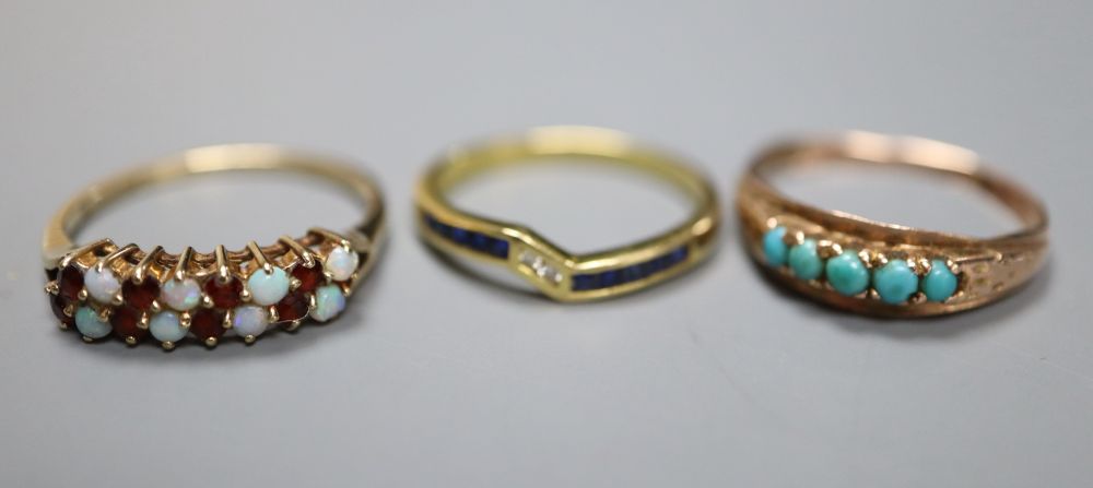 A modern 750 , sapphire and diamond set ring, gross 1.9 grams, and two other gem set rings including 9ct gold, gross 3.8 grams.